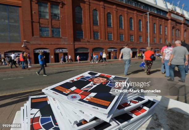 Rangers match programs bearing the name and face of Ranger new manager Steven Gerrard on display outside Ibrox Stadium during the Pre-Season Friendly...