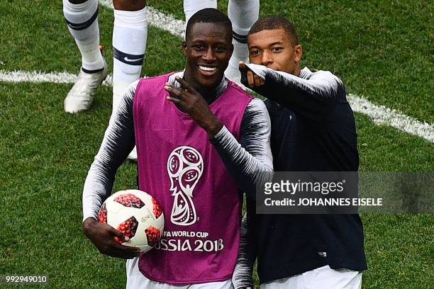 France's forward Kylian Mbappe and France's defender Benjamin Mendy celebrate their win during the Russia 2018 World Cup quarter-final football match...