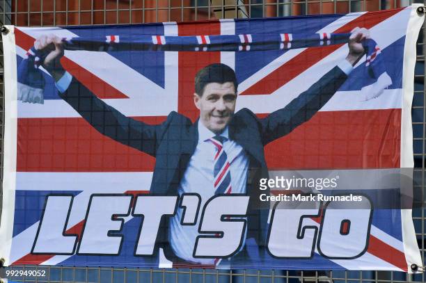 Rangers merchandise bearing the name and face of Ranger new manager Steven Gerrard on display outside Ibrox Stadium during the Pre-Season Friendly...