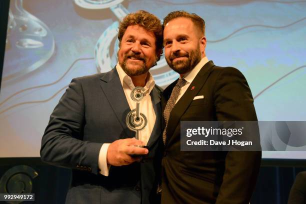 Michael Ball and Alfie Boe, winners of the PPL Classical Award on stage during the Nordoff Robbins' O2 Silver Clef Awards ceremony at Grosvenor...