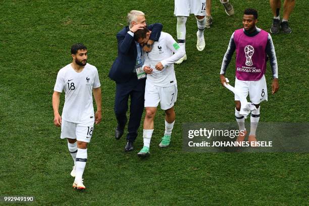 France's midfielder Nabil Fekir, France's coach Didier Deschamps, France's forward Antoine Griezmann and France's forward Thomas Lemar celebrate with...