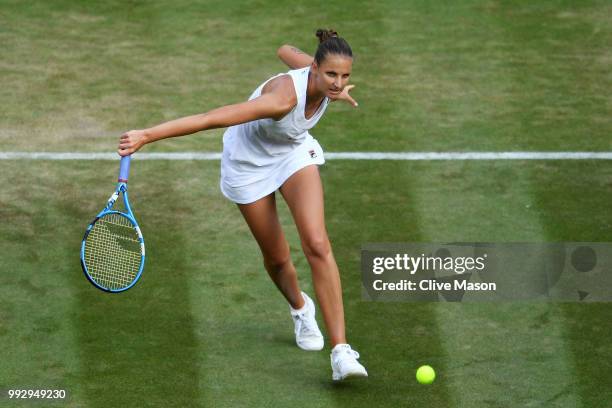 Karolina Pliskova of Czech Republic returns a shot against Mihaela Buzarnescu of Romania during their Ladies' Singles third round match on day five...