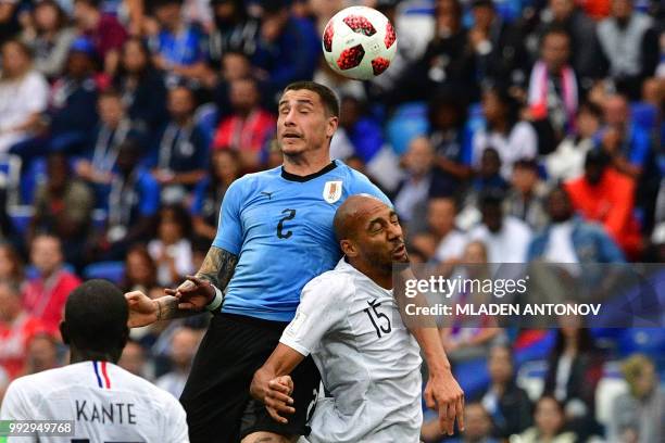Uruguay's defender Jose Gimenez heads the ball with France's midfielder Steven N'Zonzi during the Russia 2018 World Cup quarter-final football match...
