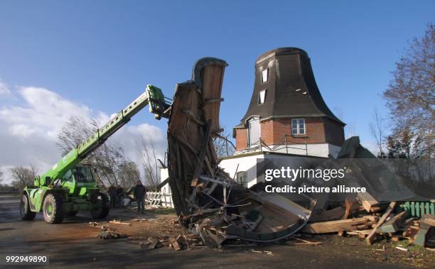 Workers salvage the remains of the windmill 'Catharina' built in 1786 in Oldenswort, Germany, 29 October 2017. The former wheat mill was partially...