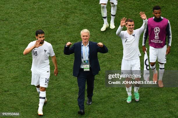 France's midfielder Nabil Fekir, France's coach Didier Deschamps, France's forward Antoine Griezmann and France's forward Thomas Lemar celebrate with...