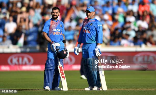 Dhoni and Virat Kohli of India during the 2nd Vitality International T20 match between England and India at SWALEC Stadium on July 6, 2018 in...