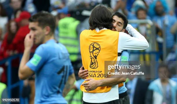 Edinson Cavani of Uruguay greets teammate Luis Suarez following the 2018 FIFA World Cup Russia Quarter Final match between Uruguay and France at...