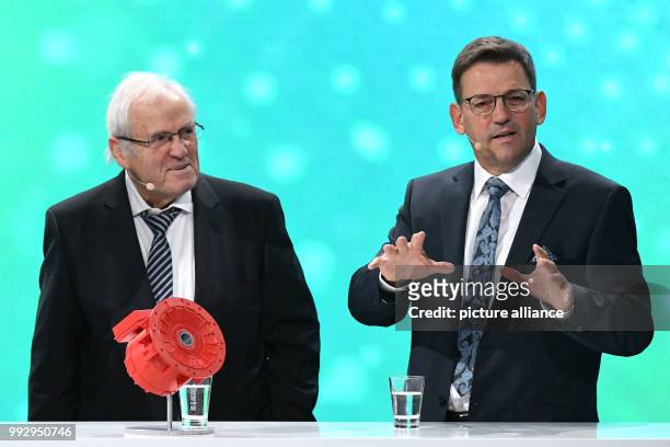 Award winners Johannes and Bernhard Oswald stand on stage during the ceremony of the German Environment Award of the German Federal Foundation for...