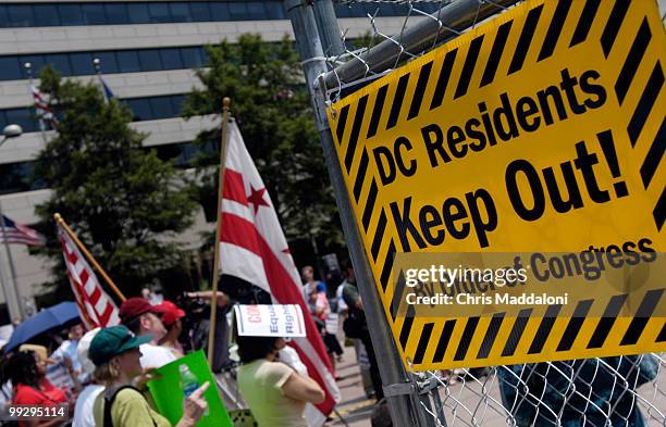 Voting machine enclosed by fencing at a rally in Freedom Plaza for DC voting rights. During the annual session of the Organization for Security and...