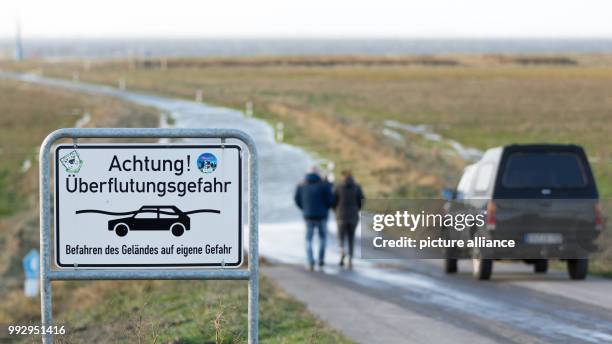 Dpatop - A sign reading 'Achtung! Ueberflutungsgefahr' (lit. 'Attention! Danger of floods' can be seen at the camping site at the city beach...