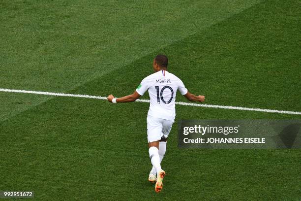 France's forward Kylian Mbappe celebrates during the Russia 2018 World Cup quarter-final football match between Uruguay and France at the Nizhny...