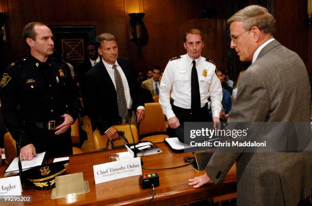 Sen. Byron Dorgan, D-ND, speaks with Gary Hagler, chief of the Flint, Mich. Police Department; Timothy Dolan, chief of the Minneapolis Police...