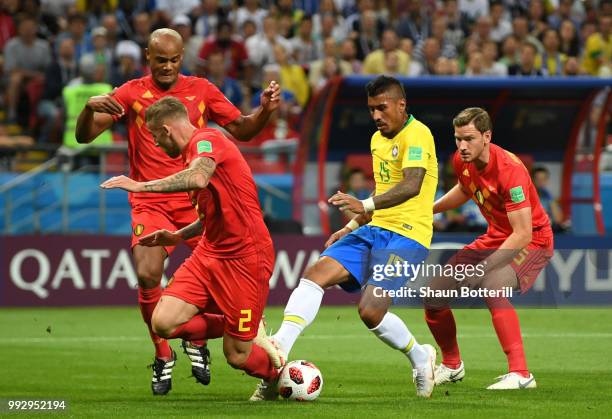 Vincent Kompany, Toby Alderweireld and Jan Vertonghen of Belgium put pressure on Paulinho of Brazil during the 2018 FIFA World Cup Russia Quarter...