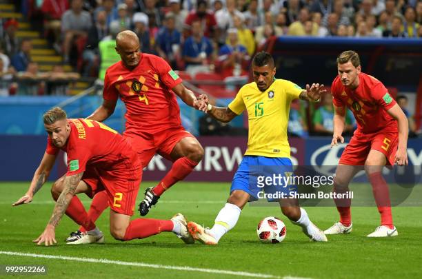 Paulinho of Brazil challenge for the ball with Toby Alderweireld, Vincent Kompany and Jan Vertonghen of Belgium during the 2018 FIFA World Cup Russia...