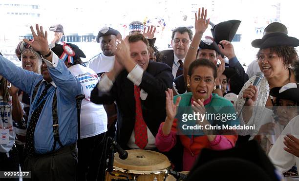 Terence McAuliffe and Rep. Eleanor Holmes Norton, D-DC, dance to a go-go band at the "Free DC! No Taxation without Representation 2nd Boston Tea...