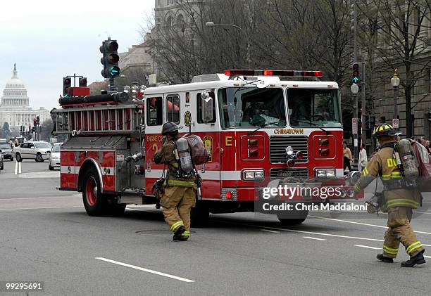 Firefighters respond to a fire in the Ronlad Reagan building in downtown Washington, DC.