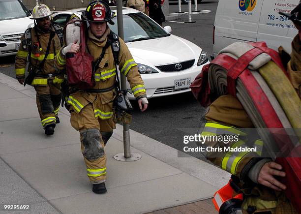 Firefighters respond to a fire in the Ronlad Reagan building in downtown Washington, DC.