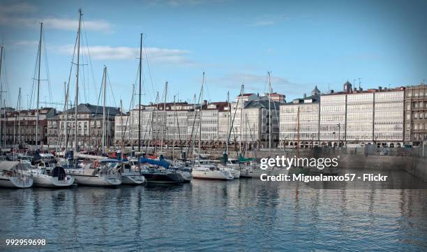 houses of glass windows and marina in a coruna (galicia, spain) - darsena stock-fotos und bilder