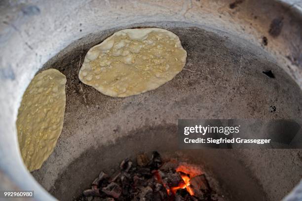 naan bread, indian flat bread baked in a tandoori oven - tandoor oven stock pictures, royalty-free photos & images