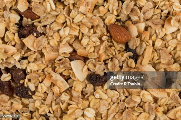 closeup of a pile of muesli cereal breakfast oatmeal - raisin bran stock pictures, royalty-free photos & images