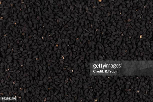 sesame black seeds close up for background - macrobiotic diet stock pictures, royalty-free photos & images