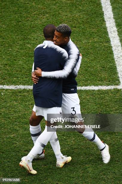 France's forward Kylian Mbappe celebrates with France's defender Presnel Kimpembe after their win during the Russia 2018 World Cup quarter-final...