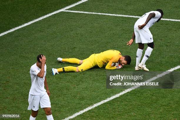 France's goalkeeper Hugo Lloris holds onto the ball during the Russia 2018 World Cup quarter-final football match between Uruguay and France at the...