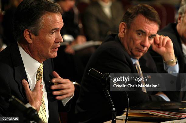 Secretary of Health and Human Services Tommy Thompson looks at Sen. John Breaux, D-La., as they argue about Medicad reform at the 2003 National...