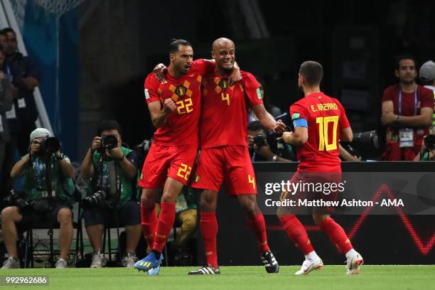 Vincent Kompany, Nacer Chadli and Eden Hazard of Belgium celebrate after Fernandinho of Brazil scored an own goal to make it 0-1 during the 2018 FIFA...