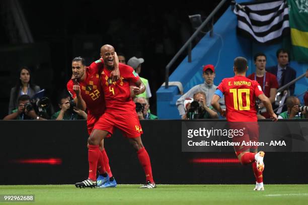 Vincent Kompany, Nacer Chadli and Eden Hazard of Belgium celebrate after Fernandinho of Brazil scored an own goal to make it 0-1 during the 2018 FIFA...