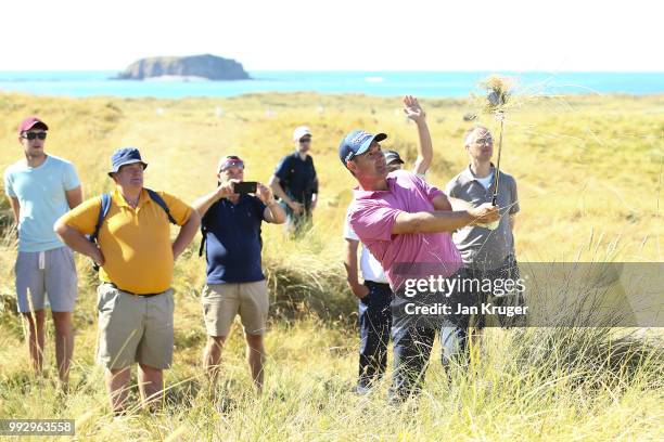 Padraig Harrington of Ireland plays from the rough on the 13th during the second round of the Dubai Duty Free Irish Open at Ballyliffin Golf Club on...