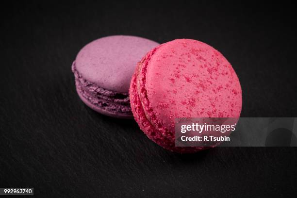 tasty colorful macaroons on dark stone background - 2016 243 stock pictures, royalty-free photos & images