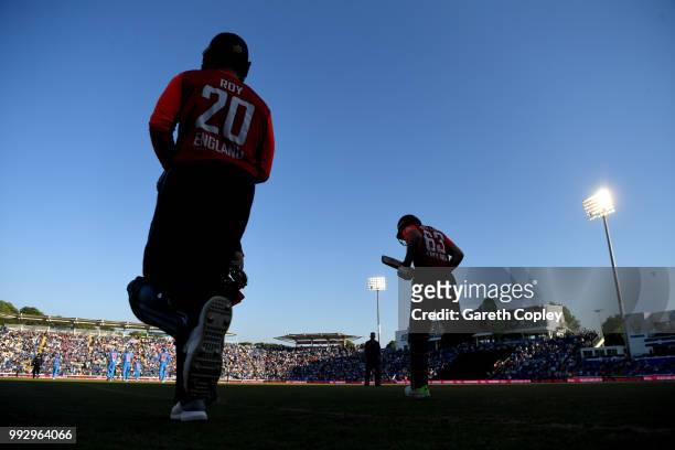 Jos Buttler and Jason Roy of England walk out to bat during the 2nd Vitality International T20 match between England and India at SWALEC Stadium on...