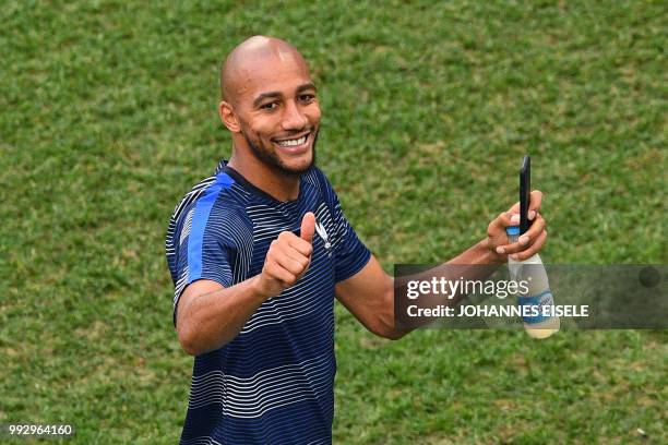 France's midfielder Steven N'Zonzi greets the fans after the Russia 2018 World Cup quarter-final football match between Uruguay and France at the...