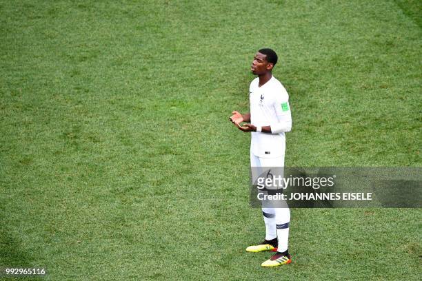 France's midfielder Paul Pogba prays during the Russia 2018 World Cup quarter-final football match between Uruguay and France at the Nizhny Novgorod...