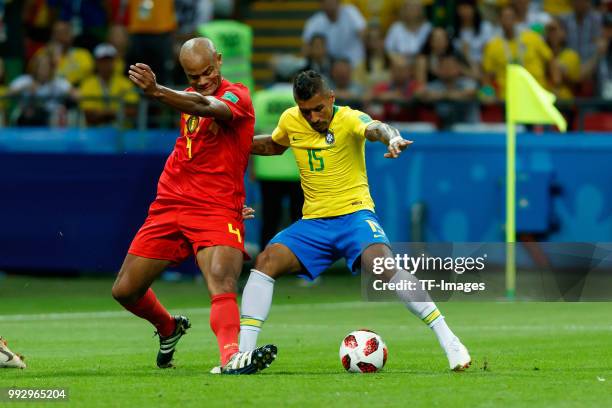 Vincent Kompany of Belgium and Paulinho of Brazil battle for the ball during the 2018 FIFA World Cup Russia Quarter Final match between Brazil and...