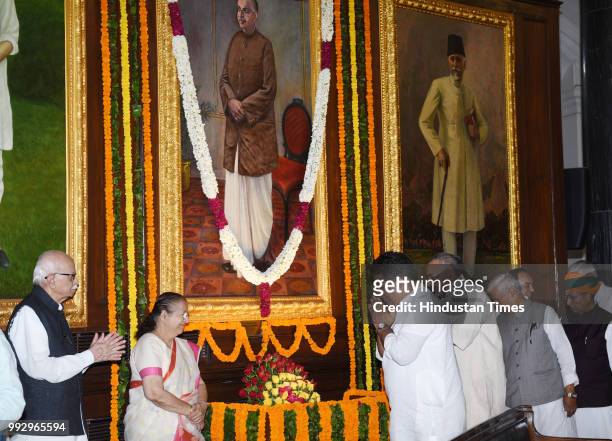 Lok Sabha Speaker Sumitra Mahajan along with Senior BJP leaders L K Advani and Bhupender Yadav pay floral tribute, to Syama Prasad Mookerjee, on his...