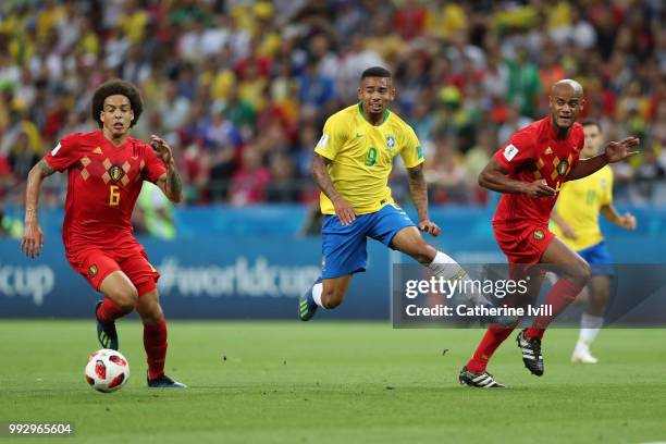 Gabriel Jesus of Brazil is challenged by Axel Witsel and Vincent Kompany during the 2018 FIFA World Cup Russia Quarter Final match between Brazil and...