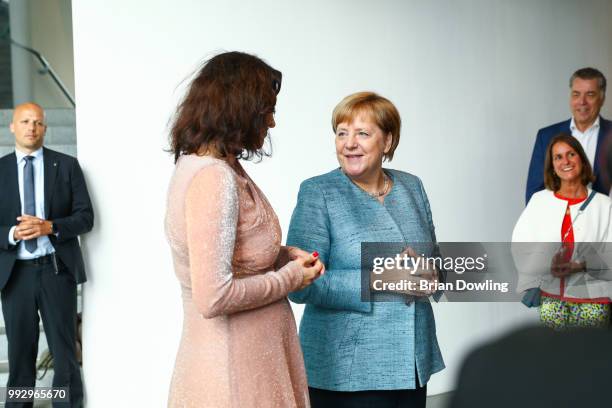 Dorothee Baer and German Federal Chancellor Angela Merkel attend the Fashion Council Germany reception at Bundeskanzleramt on July 6, 2018 in Berlin,...