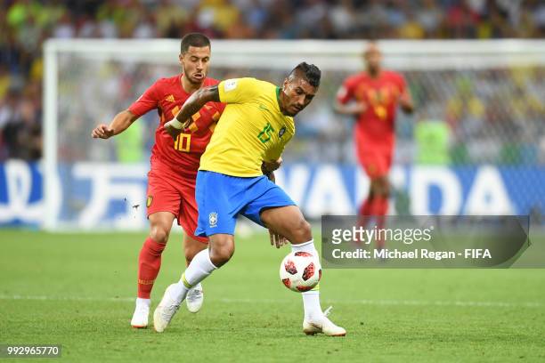 Paulinho of Brazil is challenged by Eden Hazard of Belgium during the 2018 FIFA World Cup Russia Quarter Final match between Brazil and Belgium at...