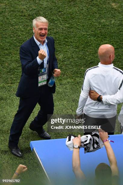 France's coach Didier Deschamps celebrates at the final whistle during the Russia 2018 World Cup quarter-final football match between Uruguay and...