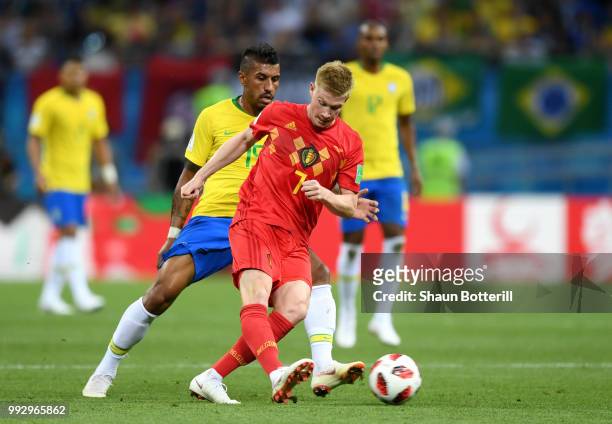 Kevin De Bruyne of Belgium is challenged by Paulinho during the 2018 FIFA World Cup Russia Quarter Final match between Brazil and Belgium at Kazan...