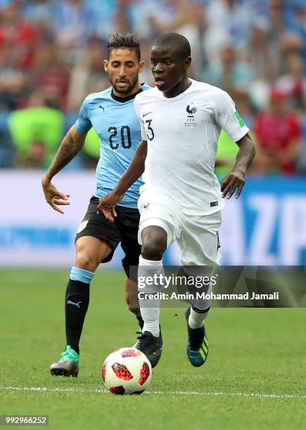 Jonathan Urretaviscaya of Uruguay and Ngolo Kante of France in action during the 2018 FIFA World Cup Russia Quarter Final match between Uruguay and...