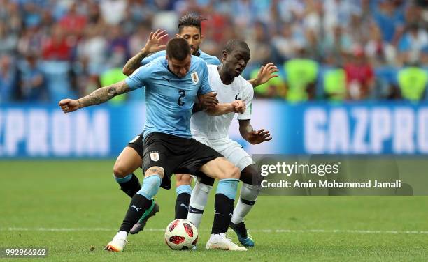 Jonathan Urretaviscaya of Uruguay and Ngolo Kante of France in action during the 2018 FIFA World Cup Russia Quarter Final match between Uruguay and...