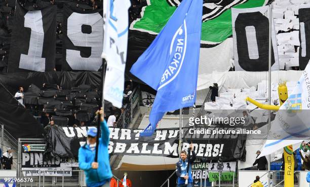 Gladbach's fans hold up a banner saying 'Und ihr? Huren eines Fussballmorders!' at the beginning of the Bundesliga soccer match between 1899...