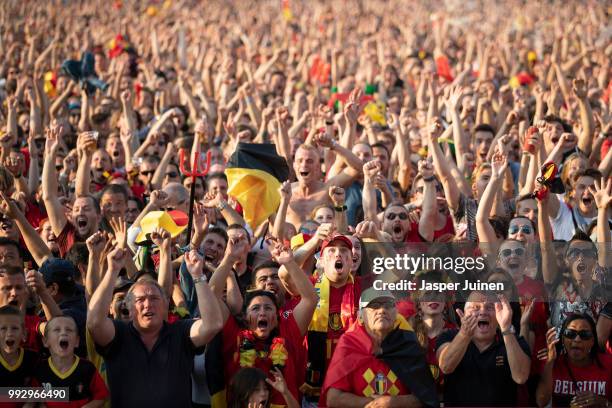 Belgian football fans celebrate their teams opening goal during the World Cup Quarter Final match between Brazil and Belgium at a fan village on July...