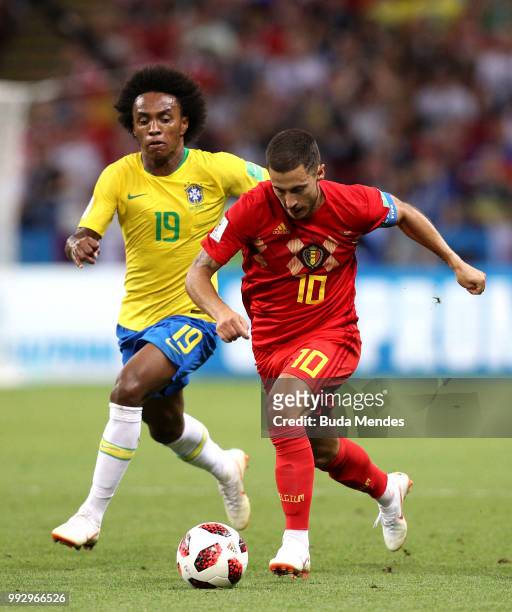 Eden Hazard of Belgium is challenged by Willian of Brazil during the 2018 FIFA World Cup Russia Quarter Final match between Brazil and Belgium at...