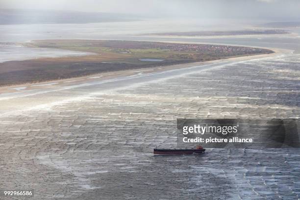 The bulk carrier 'Glory Amsterdam' is seen stranded near the island Langeoog in the German Bight after storm 'Herwart' hit the country on 30 October...