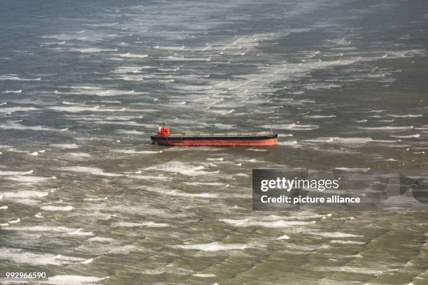 The bulk carrier 'Glory Amsterdam' is seen stranded near the island Langeoog in the German Bight after storm 'Herwart' hit the country on 30 October...