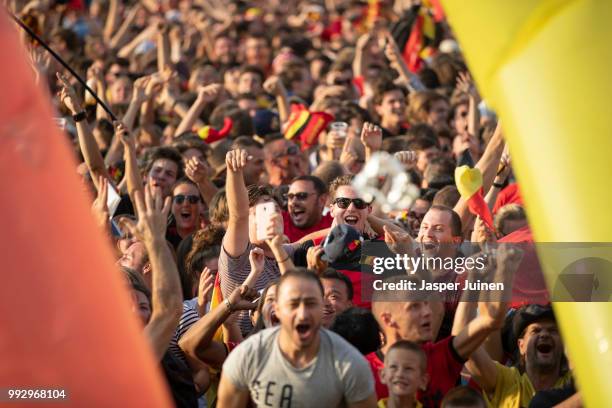 Belgian football fans celebrate their teams opening goal during the World Cup Quarter Final match between Brazil and Belgium at a fan village on July...